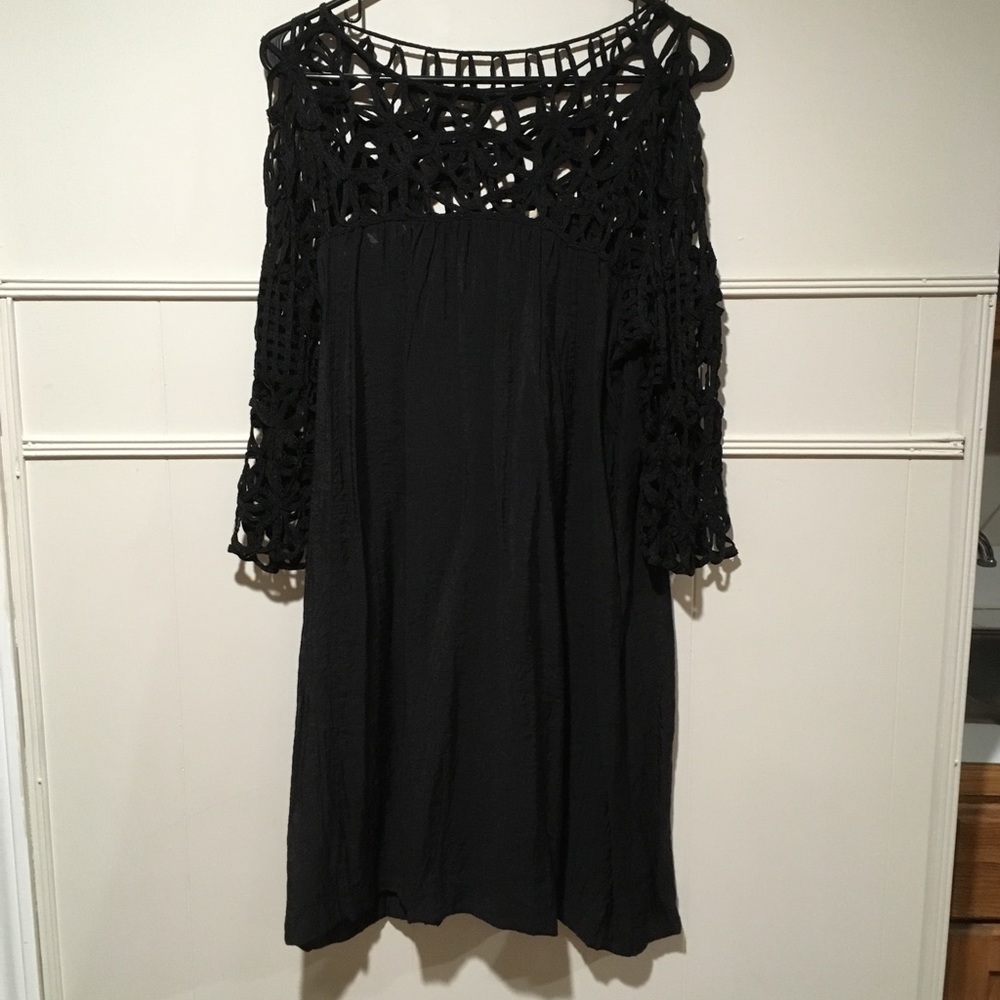 Black dress with lack neckline and sleeves
